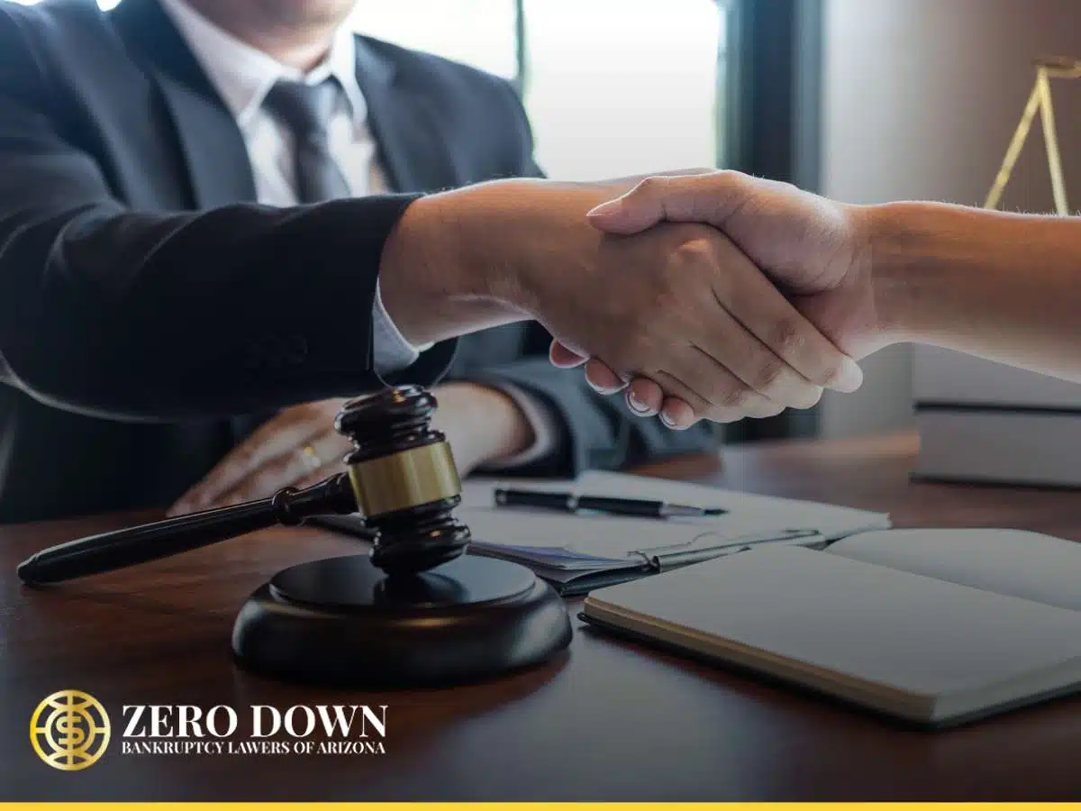 Lawyer and client shaking hands in an office, symbolizing Chapter 11 Bankruptcy legal assistance