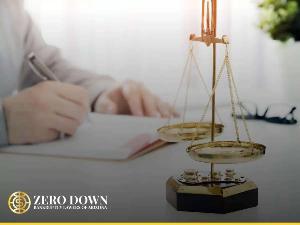 A lawyer working on paperwork beside a justice scale, highlighting Bankruptcy Filing