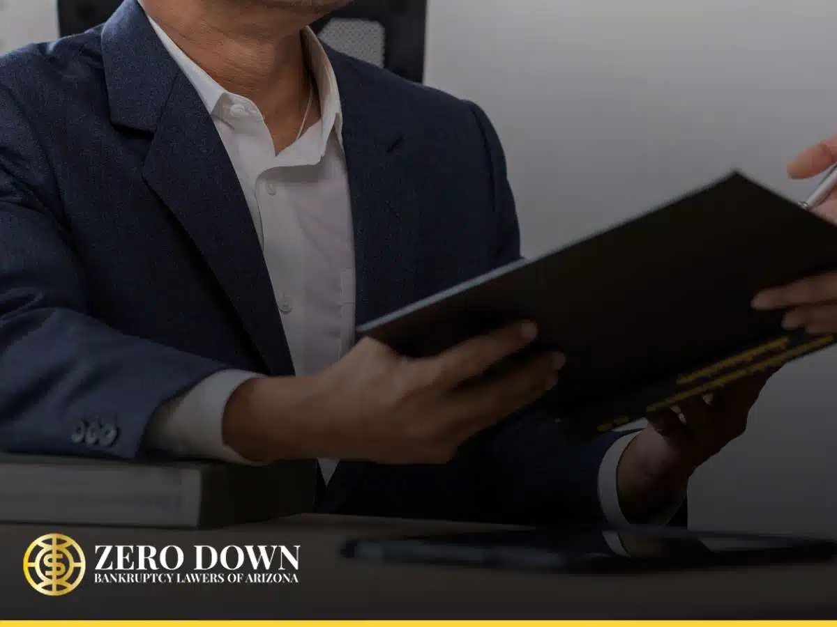 Lawyer discussing bankruptcy documents with a client